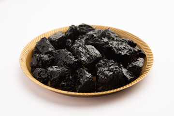 Shilajit is an ayurvedic medicine found primarily in the rocks of the Himalayas. selective focus