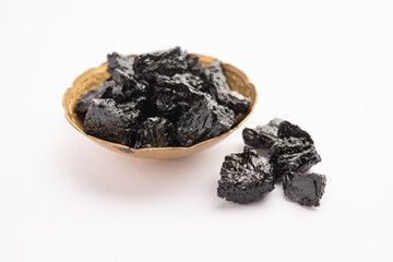 Shilajit is an ayurvedic medicine found primarily in the rocks of the Himalayas. selective focus