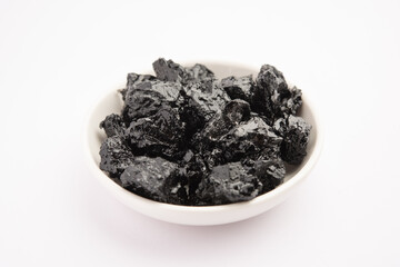 Shilajit is an ayurvedic medicine found primarily in the rocks of the Himalayas. selective focus