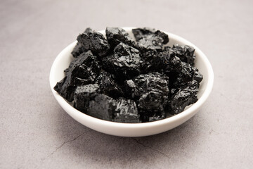 Shilajit is an ayurvedic medicine found primarily in the rocks of the Himalayas. selective focus