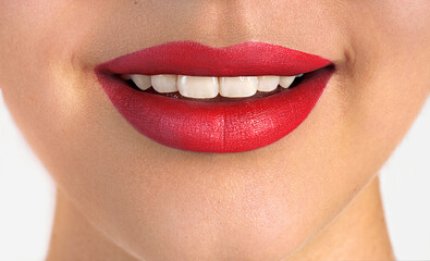 Obraz premium Beautiful woman lips with red lipstick. Smiling mouth with white teeth.