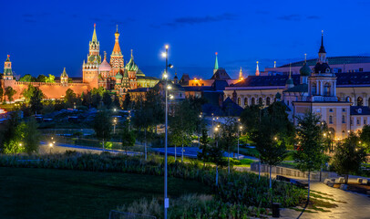 Fototapeta na wymiar Spasskaya Tower, Moscow Kremlin, Saint Basil's Cathedral, Park Zaryadye at night in Moscow, Russia. Architecture and landmarks of Moscow. Postcard of Moscow