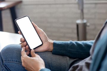cell phone blank white screen mockup.hand holding texting using mobile on desk at office.background empty space for advertise.work people contact marketing business,technology