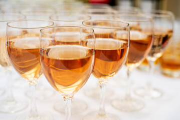 close-up of a lot of glasses of rose wine