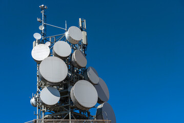 Antenna communication technology on blue sky with copy space. Communication tower connect to data...
