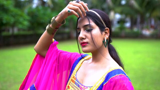 Beautiful Indian woman in traditional chaniya choli for navratri. Navratri is an Indian Festival and Chaniya choli its traditional costume