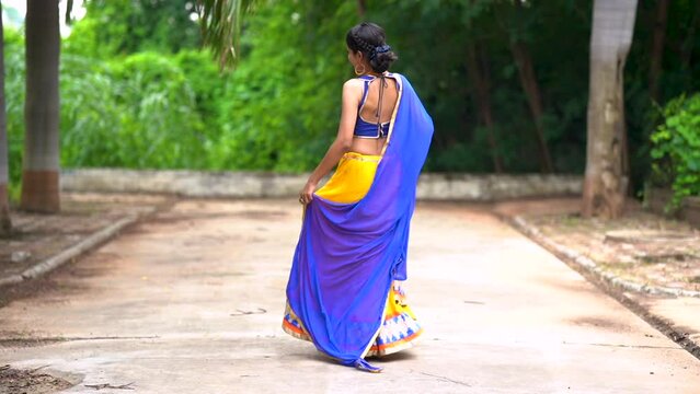 Beautiful Indian woman in traditional chaniya choli for navratri. Navratri is an Indian Festival and Chaniya choli its traditional costume