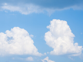 White fluffy clouds in blue sky for background