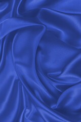 Obraz premium Red silk or satin luxury fabric texture can use as abstract background. Top view.