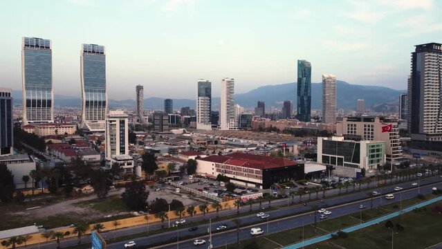Izmir, Turkey - April 15, 2022: Aerial footage view of Izmir city from above Izmir bay sea with the skyscrappers which ones Folkart Towers, mistral, Ege Perla and Bayrakli region