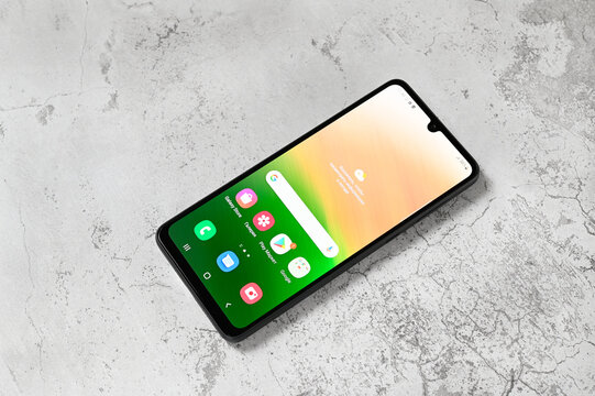 Smartphone Samsung Galaxy A33 5G SM-A336BDS Black on a white stone background in Russia, Moscow, July 15, 2022