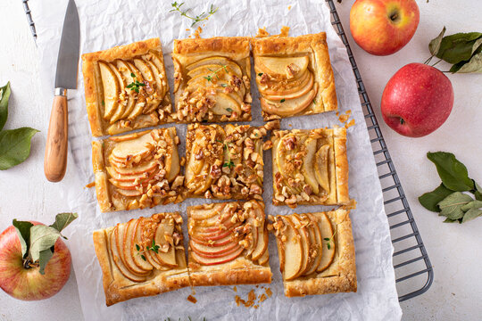Apple tart with puff pastry tpped with walnuts and brown sugar