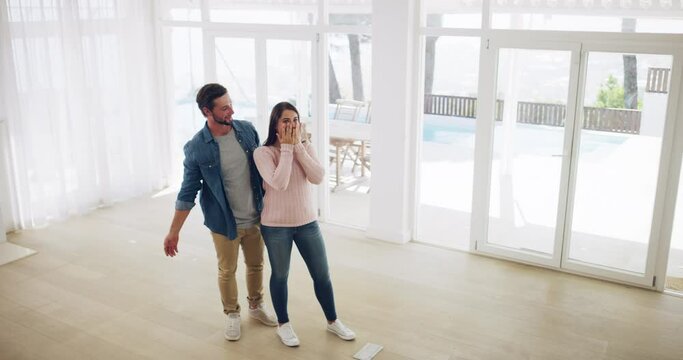 New house, property deal and real estate sale surprise of a man showing his wife the home interior. Husband cover the eyes of a happy woman with a wow expression and smile in love with the building