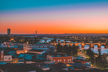 Beautiful sunset in the city of Badajoz, golden hour orange sky at dusk in a city.