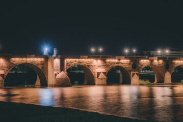 Fototapeta na wymiar Reflection of lights on the river in the city, reflections in the river city of badajoz