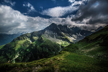 Obraz na płótnie Canvas A stormy and very photogenic walk through the alpine mountains near Bad Gastein.