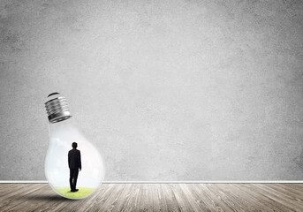 Businessman trapped in bulb