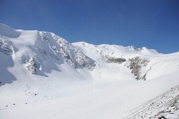 Fototapeta na wymiar Scenic snowy Aktru mountain of North Chuya Range in southeastern part of Altai 