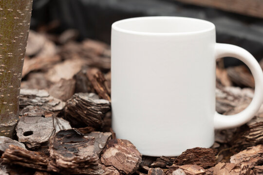 White mug in the garden.