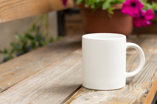 White mug in the garden.
