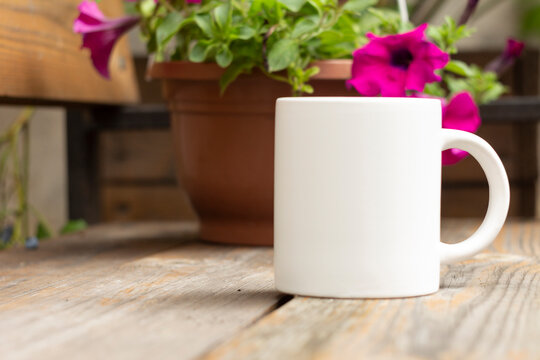 White mug in the garden.