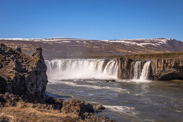 Obraz premium Godafoss waterfall, Iceland. Beautiful daily exposure done during the summer, of this famous landmark in Iceland. One of the most looking after travel destination in Iceland.