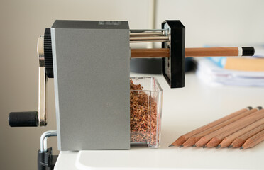 Colored and graphite desk top pencil sharpener with shavings tray