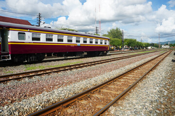 Fototapeta premium Train bogies on train tracks at Thai train stations on a clear day.