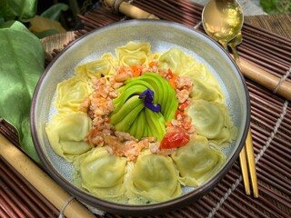 Ravioli stuffed with chopped spinach Parmesan Cheese and Ricotta Cheese with avocados