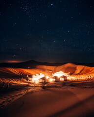 a beautiful and luxury desert camp in the erg chebli Sahara Desert in Morocco, Africa at night
