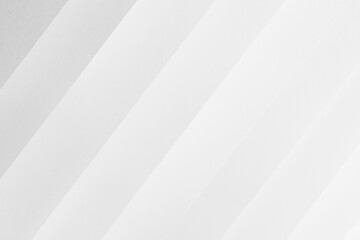 Obraz premium White abstract geometric background with soft light parallel inclined diagonal paper stripes with gradient in simple minimal elegant modern style.