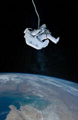 Space suits isolated on space background. Elements of this image furnished by NASA. © wasan