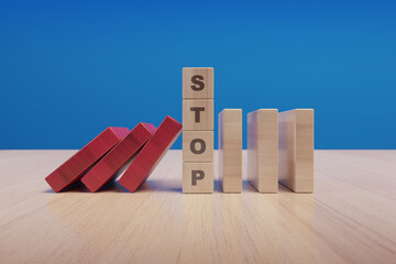Stop text made with wooden blocks on a table