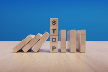 Stop text made with wooden blocks on a table