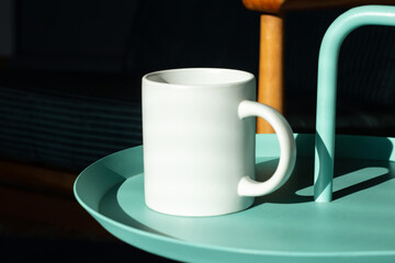 White mug on the table. - 525352226