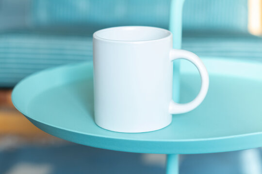 White mug on the table.