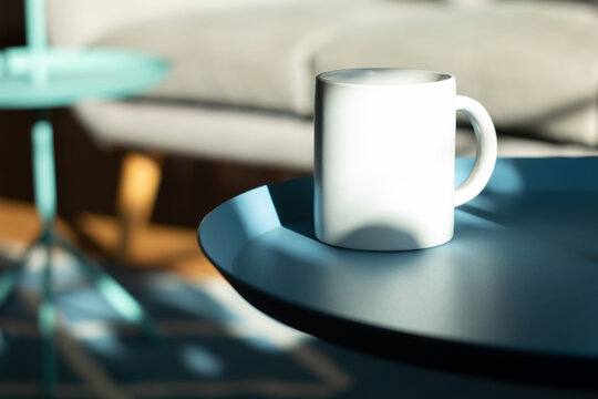 White mug on the table.