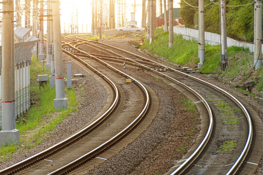 Two railway tracks for different directions of train movement. View of the graceful turn of the railway line.