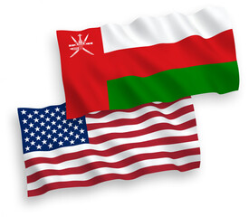 National vector fabric wave flags of Sultanate of Oman and USA isolated on white background. 1 to 2 proportion.