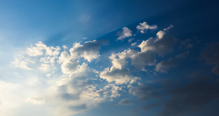Obraz premium Dreamy blue sky background with white clouds