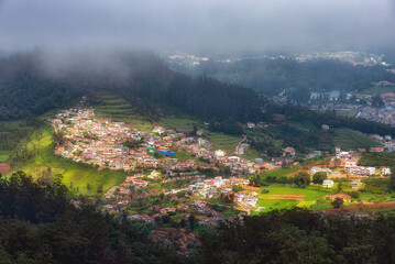 View of Ooty town from Doddabetta View Point, India. Doddabetta is the highest peak in the Nilgiri Mountains at 2,637 metres (8,652 feet). It is a popular tourist attraction