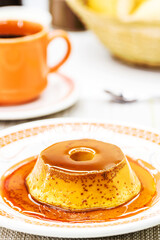 small Brazilian condensed milk pudding, homemade dessert, topped with vanilla syrup