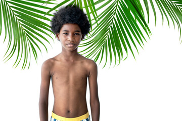 African boy unless shirt without emotions face, standing in front of palm leaves, on white...
