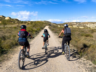 Fototapeta premium family riding on mountain bike in countryside