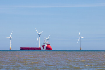 Offshore wind farm turbines with maintenance with supply ship