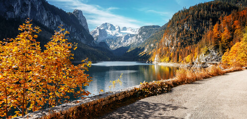 Stunning Landscape of Alpine Lake. Gosausee Vorderer lake and Dachstein mount Under sunlight. Gosau...