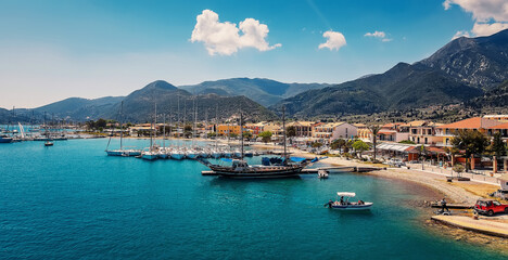 Amazing sunny seascape of Greece. Fairy tale sea bay, with luxury yachts and hotels. Spring...