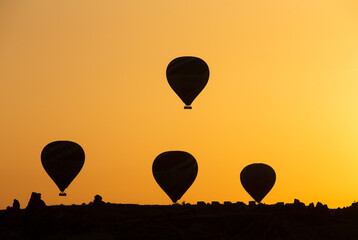 Balloons in the sky in magnificent Cappadocia accompanied by the sunrise view stock photo