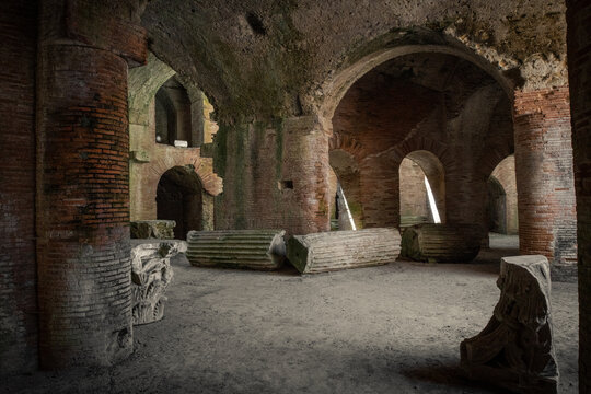 Pozzuoli, Italy - August 14, 2020: Amfiteatro di Pozzuoli archeological excavations. Roman amphitheatre remains and ruins. Heritage of Mediterranean culture. Italian Unesco site