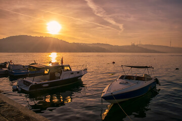 Fototapeta premium Boats moored in Istanbul at sunset.